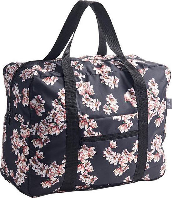 Sac de voyage noir avec un imprimé floral de magnolias roses, blancs et verts. Poignées et fermetures éclair noires.