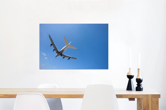 Avion volant dans le ciel bleu clair Aluminium 90x60 cm - Tirage photo sur aluminium (décoration murale en métal)