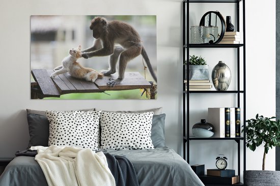 Toile de singe tirant les oreilles de chat 2cm 120x80 cm - Tirage photo sur toile (Décoration murale salon / chambre) / Peintures sur toile pour Animaux domestiques