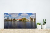 Canvas Schilderij Uitzicht over de Duitse stad Lübeck - 40x20 cm - Wanddecoratie