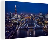 Canvas Schilderij De Tower Bridge verlicht in de nacht in Engeland - 60x40 cm - Wanddecoratie