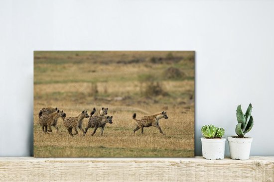 Canvas Schilderij Hyena's - Jagen - Afrika - 30x20 cm - Wanddecoratie