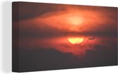Canvas Schilderij Zonsondergang met silhouet van vliegtuig - 80x40 cm - Wanddecoratie