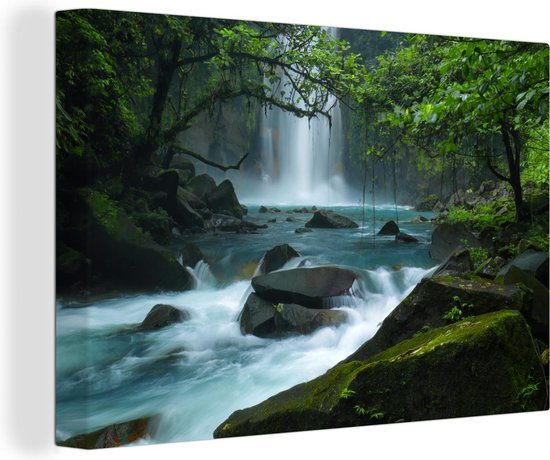 Canvas Schilderij Helderblauwe wilde rivier en watervallen in het regenwoud van Costa Rica - 60x40 cm - Wanddecoratie