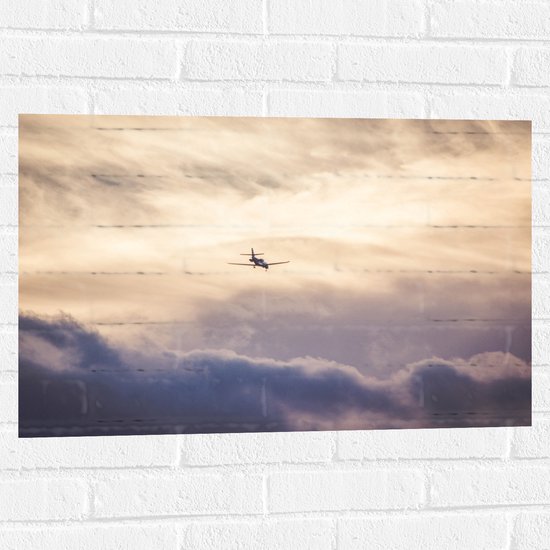 Muursticker - Vliegtuig tussen de Wolken - 75x50 cm Foto op Muursticker