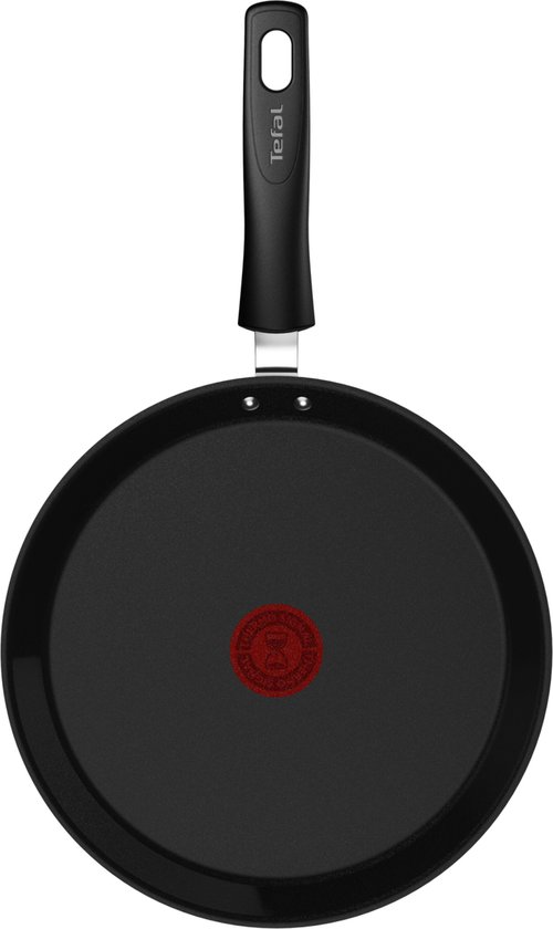 Zwarte Tefal crêpepan met ronde bodem, van bovenaf gezien.