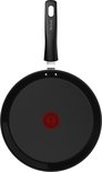 Zwarte Tefal crêpepan met ronde bodem, van bovenaf gezien.