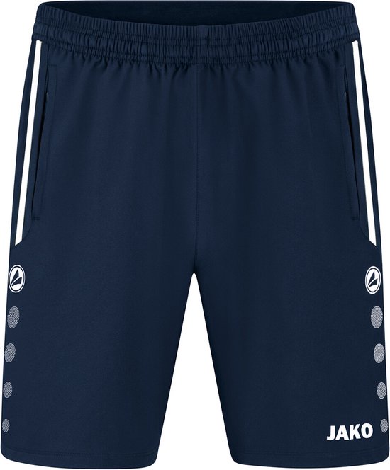 Short de sport bleu marine Jako avec des bandes blanches sur les côtés et logo Jako avec des points.