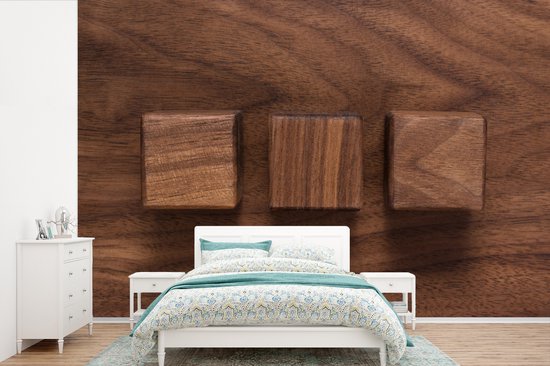 Cubes en bois sur un fond en bois fotobehang