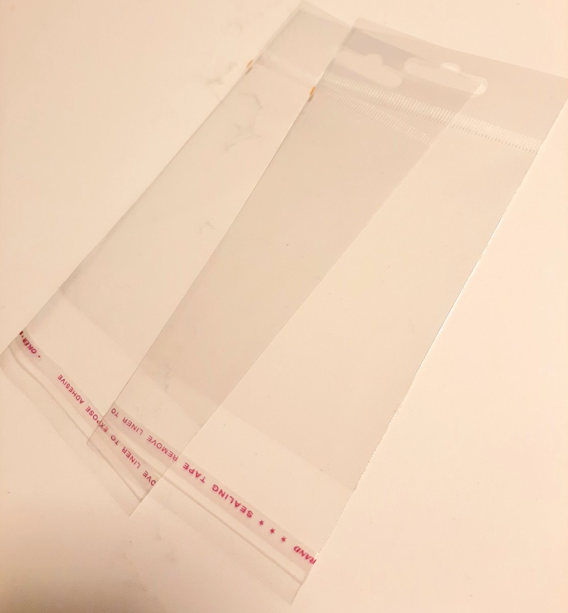 transparant zakje met eurolock ophang gat en kleefstrip - zelfklevende plakstrip - 50 transparante zakjes - 11 x 8 cm