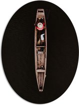 WallClassics - PVC Schuimplaat Ovaal - Bovenaanzicht van Visser in Smal Houten Vissersbootje op Donker Water - 81x108 cm Foto op Ovaal (Met Ophangsysteem)