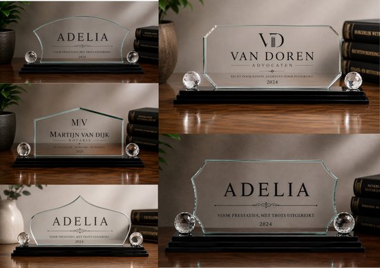 Een collage van drie glazen trofeeën met tekst, waaronder 'ADELIA' en 'VAN DOREN ADVOCATEN'.