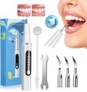 Complete set met ultrasone tandsteenverwijderaar, opzetstukken, spiegel en een doos met gele visjes.