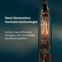 Close-up van de interne, koperkleurige sonische technologie van een Philips tandenborstel.