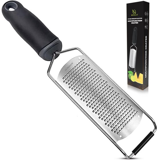 Râpe multifonctionnelle noire en acier inoxydable avec une poignée ergonomique, à côté de l'emballage.