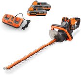 FUXTEC heggenschaar met oranje en zwarte details, twee 20V accu's en een oplader.