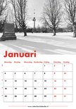 Kalenderpagina Januari met een winterlandschap in het park met een standbeeld en de Euromast in de verte.