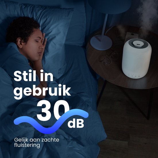 Humidificateur Auraonic blanc avec 30 dB de bruit. Une femme dort à côté.