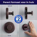 Set van 2 zwarte, zelfklevende haken met een diameter van 6 cm. Afmeting 4,5 cm diep.