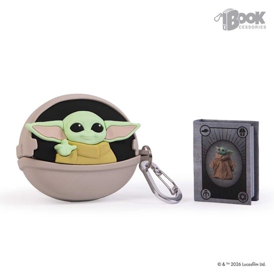 Een ronde, beige hoes met een afbeelding van Grogu, met een sleutelhanger en een klein boekje met Grogu erop.