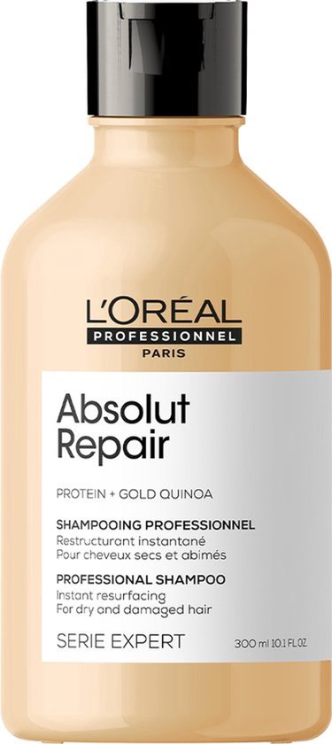 L'Oréal Professionnel Absolut Repair shampoo, 300ml. Beige fles met zwarte pompdispenser. Beschrijft 'Protein + Gold Quinoa' en 'voor droog en beschadigd haar'.