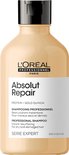 L'Oréal Professionnel Absolut Repair shampoo, 300ml. Beige fles met zwarte pompdispenser. Beschrijft 'Protein + Gold Quinoa' en 'voor droog en beschadigd haar'.