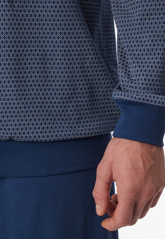 Donkerblauwe pyjamabroek met elastische tailleband en manchetten, met een subtiel all-over patroon op het shirt.