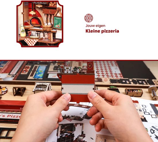 Close-up van het interieur van een miniatuur pizzeria met oven en werkblad.