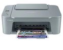 Grijze Canon Pixma printer met een document uit de printer.