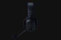 Zwarte gaming headset met blauwe stiksels en microfoon, zijaanzicht.