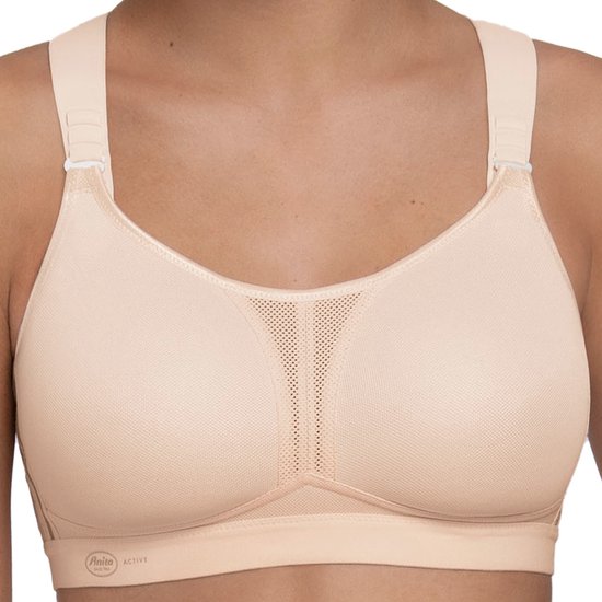 Nude sportbh met verstelbare bandjes en mesh panelen op de cups. Anita Active logo op de band.