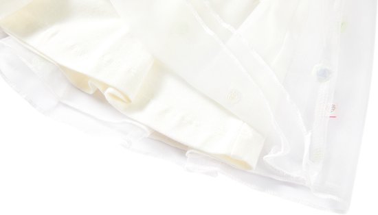 Onderkant van een off-white tule rok met veelkleurige stippen, laat de voering zien.
