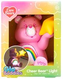 Veilleuse Cheer Bear rose en boîte, avec un arc-en-ciel et une étoile jaune.