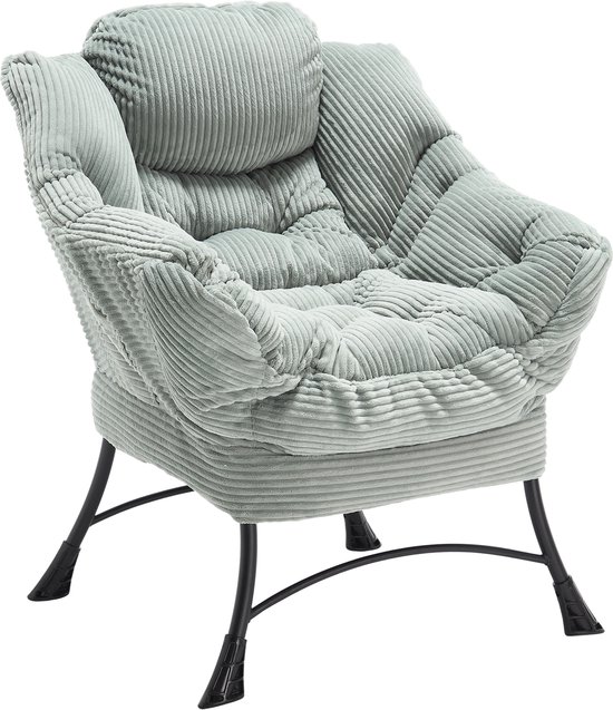 Lichtgroene corduroy loungestoel met hoofdsteun en zwarte metalen poten.
