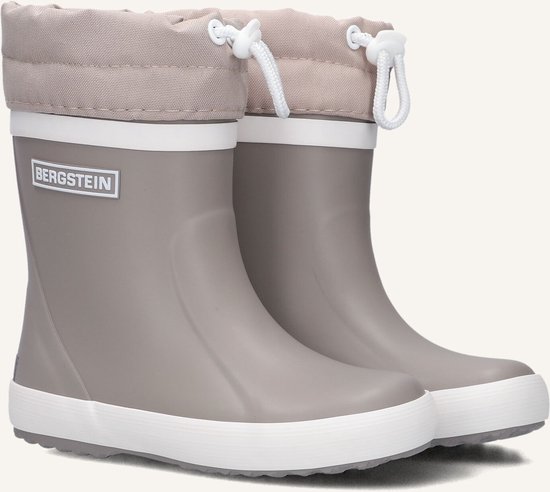 Paar beige Bergstein regenlaarzen, zijkant, met witte zolen en gesmokte schachten met trekkoord.