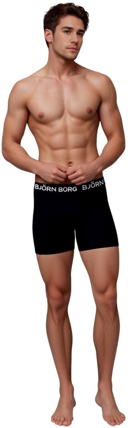 Man in het midden van zijn lichaam, draagt een zwarte Björn Borg boxer met witte merknaam.