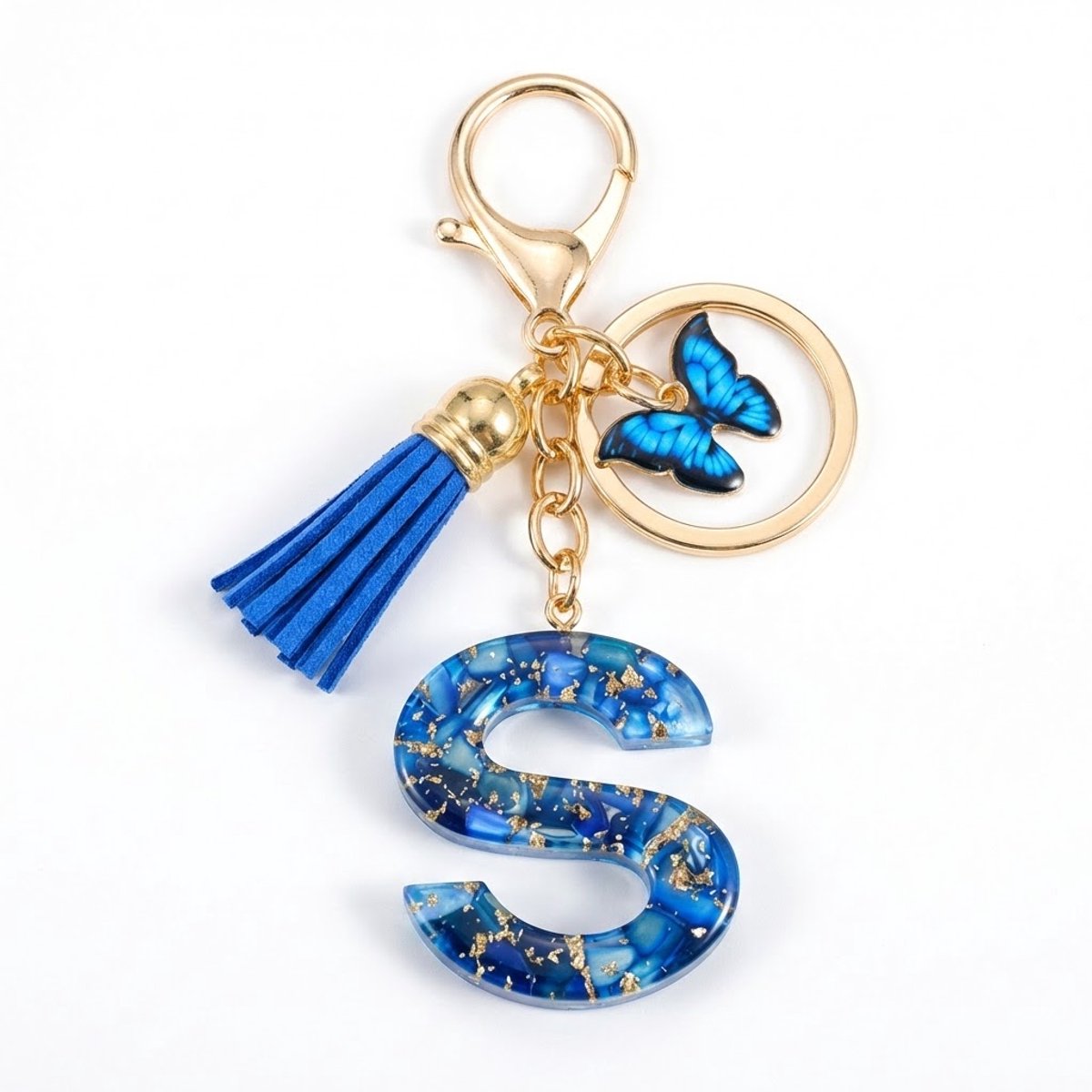 Blauwe letter S sleutelhanger met kwastje en vlinder – sleutelhanger voor dames – goudkleurige metalen keychain met acryl initiaal S hanger, decoratieve bedel en tassel