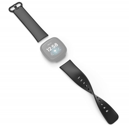 Fitbit noir avec lunette grise, affichage 12h58, et bracelets détachés.