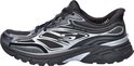 Zwarte Skechers sneaker met zilverkleurige details en 'Slip-ins' logo.