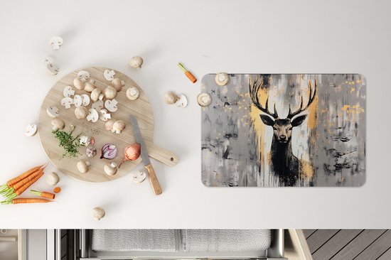 Un set de table représentant un cerf stylisé avec des accents dorés et des bois.