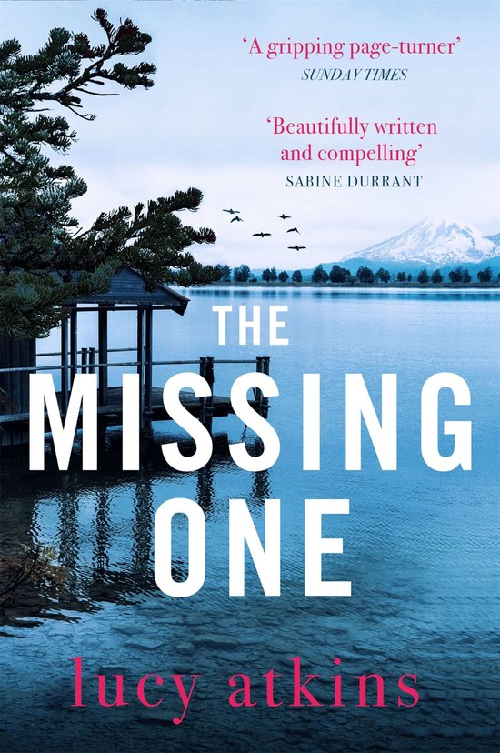 Boekcover van 'The Missing One' met een rustig meer, bergen en een houten aanlegsteiger. Tekst: 'A gripping page-turner', 'Beautifully written and compelling', THE MISSING ONE, lucy atkins.