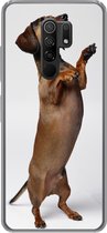Geschikt voor Xiaomi Redmi 9 hoesje - Een Teckel die op haar achterste twee poten staat - Siliconen Telefoonhoesje