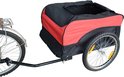 Zijaanzicht van een rode en zwarte fietskar die aan een fiets is bevestigd.