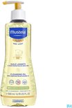 Fles Mustela doucheolie met gele pompdispenser. Het etiket toont een teddybeer en de tekst 'PEAU SECHE DRY SKIN'.