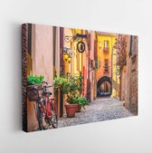 Cozy narrow street in Ferrara, Emilia-Romagna, Italy. Ferrara is capital of the Province of Ferrara- Modern Art Canvas - Horizontal - 1247082868 - 115*75 Horizontal