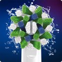 Close-up van een Oral-B opzetborstel met groene, witte en blauwe borstelharen en water.