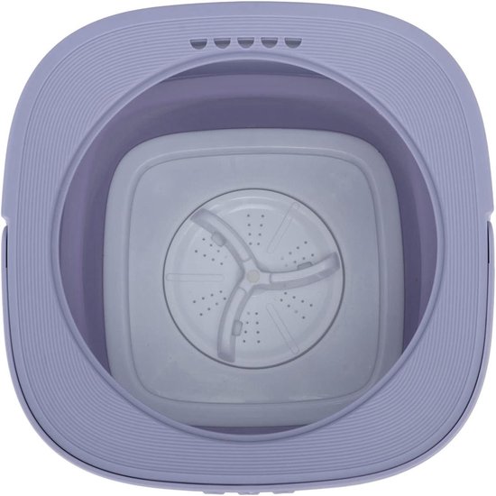 Vue de dessus de la mini-lave-linge violette, montrant l'intérieur et la plaque tournante.