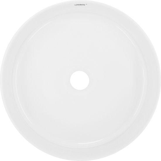 Van bovenaf gezien, een witte, ronde wastafel met het merk LuxeBath.