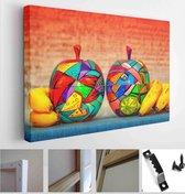 Decorative wooden apples and bananas on bright abstract background. Apples are made and painted by hand - Modern Art Canvas - Horizontal - 364225967 - 50*40 Horizontal