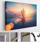 Silhouette young woman practicing yoga on the beach at sunset. Meditation - Modern Art Canvas - Horizontal - 536256619 - 80*60 Horizontal